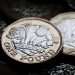 Pound recording gains versus Dollar and Euro during early Wednesday trading